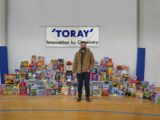 TORAY PLASTICS AMERICA EMPLOYEES DONATE TO TOYS FOR TOTS AND CARING AND SHARING PROGRAMS THIS HOLIDAY SEASON